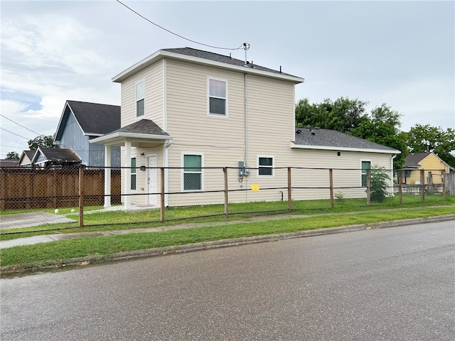 view of side of property with a yard