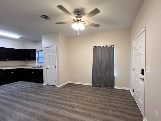 kitchen featuring dark wood-type flooring, sink, and ceiling fan