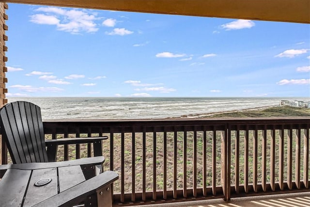 wooden deck featuring a water view