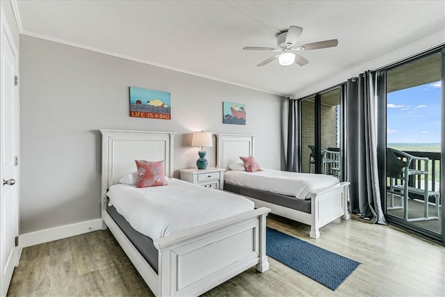 bedroom featuring ceiling fan, access to exterior, baseboards, wood finished floors, and ornamental molding