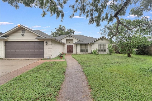 ranch-style house featuring a garage and a front lawn