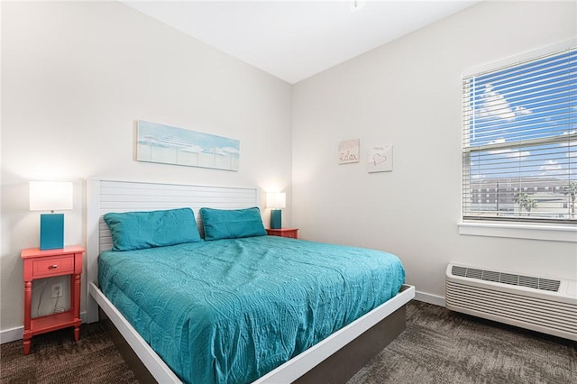 carpeted bedroom with a wall mounted AC