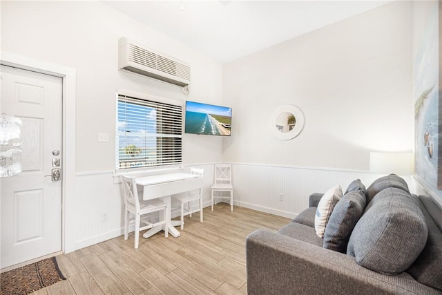 interior space featuring light hardwood / wood-style flooring and a wall unit AC