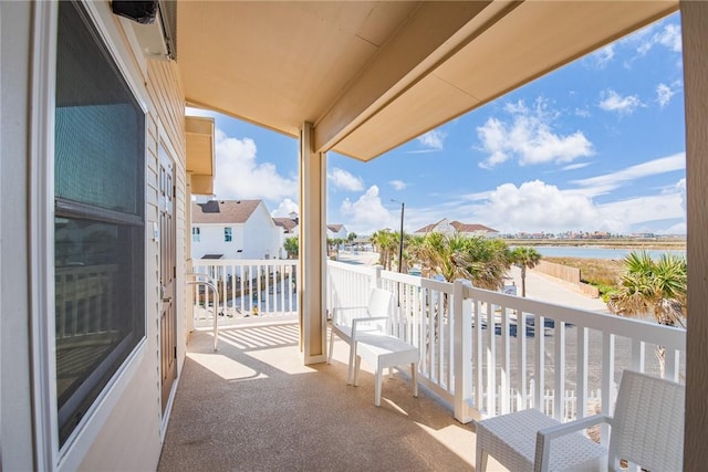 balcony featuring a water view