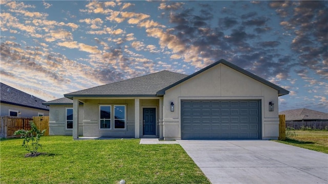 view of front of house with a lawn and a garage