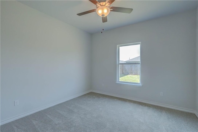 empty room featuring ceiling fan and carpet floors