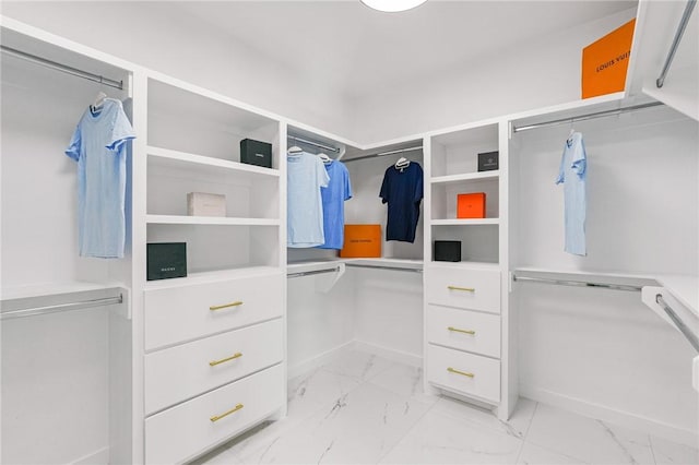 spacious closet with marble finish floor