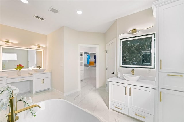 full bathroom with vanity, visible vents, marble finish floor, and a freestanding bath