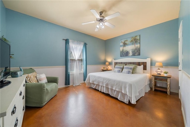 bedroom featuring ceiling fan and concrete flooring