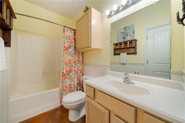 full bathroom featuring shower / bath combination with curtain, vanity, and toilet