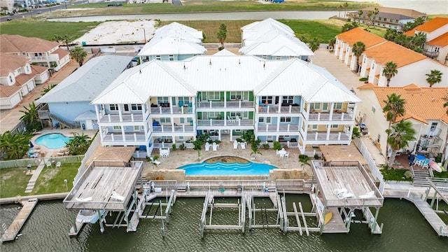14890 Granada Dr Unit 107, Corpus Christi, TX 78418 - aerial view of a pool area and a nearby body of water