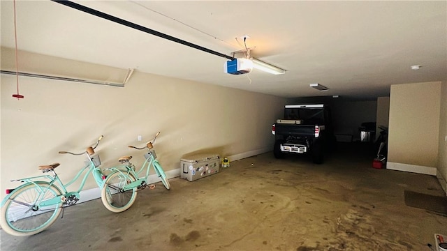 14890 Granada Dr Unit 107, Corpus Christi, TX 78418 - garage with baseboards and a garage door opener