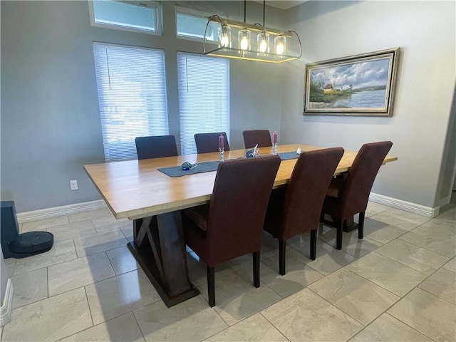 dining space featuring baseboards