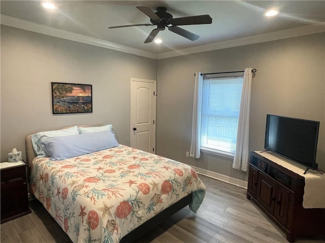 bedroom with baseboards, recessed lighting, ceiling fan, ornamental molding, and light wood-type flooring