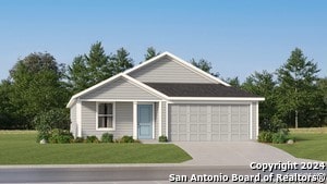 view of front facade featuring a front yard and a garage