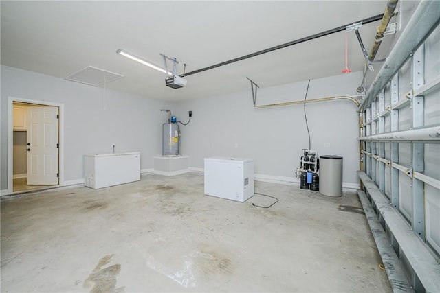 garage with a garage door opener, fridge, and water heater