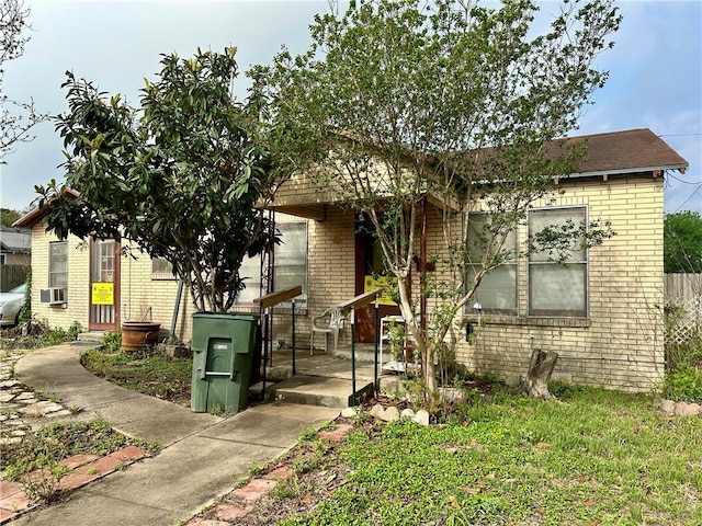 view of front of home featuring brick siding
