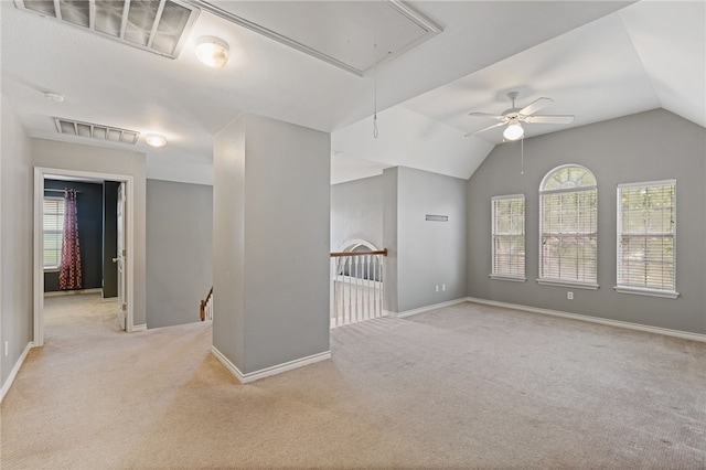 7705 Jacinto, Corpus Christi, TX 78413 - unfurnished room featuring attic access, carpet flooring, lofted ceiling, a ceiling fan, and a smoke detector