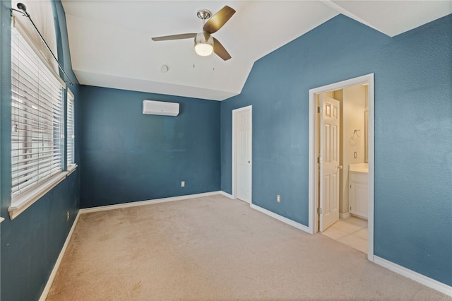 7705 Jacinto, Corpus Christi, TX 78413 - unfurnished bedroom with a wall unit AC, carpet flooring, lofted ceiling, ensuite bathroom, and a ceiling fan