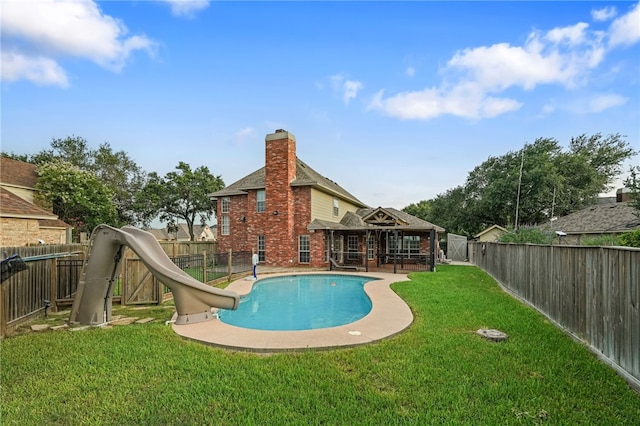 7705 Jacinto, Corpus Christi, TX 78413 - rear view of property featuring brick siding, a fenced backyard, a chimney, and roof with shingles