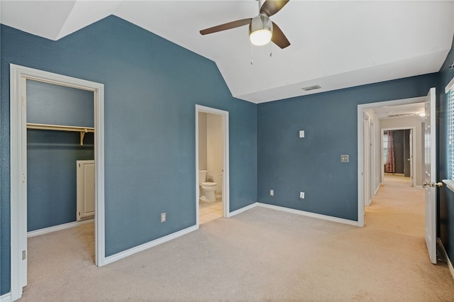 7705 Jacinto, Corpus Christi, TX 78413 - unfurnished bedroom featuring lofted ceiling, carpet flooring, a walk in closet, a closet, and ensuite bathroom