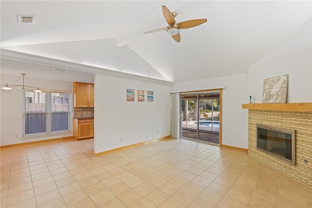 unfurnished living room with light tile patterned flooring, vaulted ceiling with beams, and ceiling fan