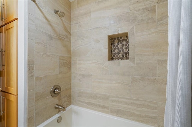 bathroom with shower / bath combo with shower curtain