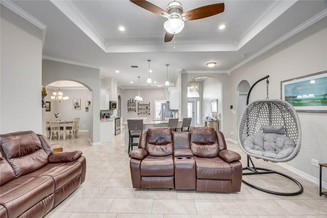 4009 Yankees Pl, Corpus Christi, TX 78414 - living room with arched walkways, a raised ceiling, light tile patterned flooring, ceiling fan, and crown molding