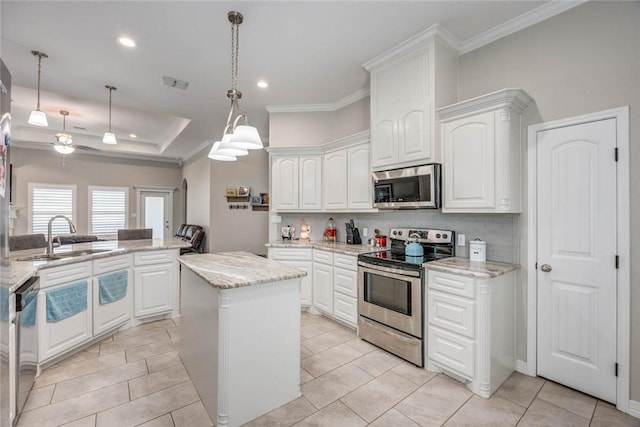 4009 Yankees Pl, Corpus Christi, TX 78414 - kitchen featuring stainless steel appliances, a sink, white cabinetry, backsplash, and crown molding