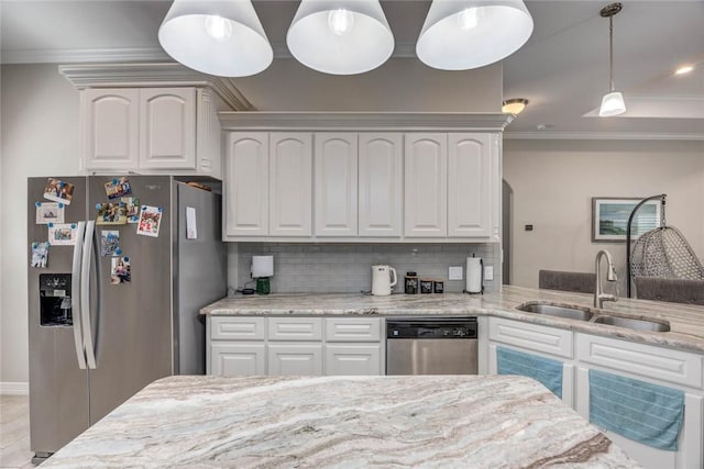 4009 Yankees Pl, Corpus Christi, TX 78414 - kitchen featuring appliances with stainless steel finishes, a sink, crown molding, light stone counters, and decorative light fixtures