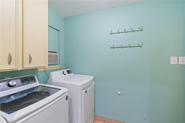 5129 Goldeneye Dr, Corpus Christi, TX 78413 - laundry room featuring cabinet space, washing machine and clothes dryer, and light tile patterned floors