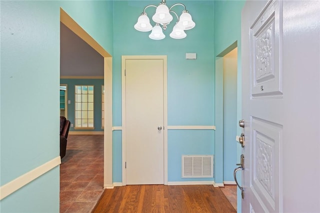 5129 Goldeneye Dr, Corpus Christi, TX 78413 - entryway featuring a chandelier, baseboards, and wood finished floors