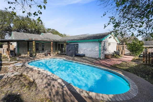 view of swimming pool featuring a patio