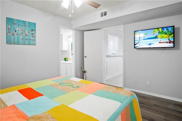 bedroom featuring ensuite bathroom, hardwood / wood-style floors, and ceiling fan