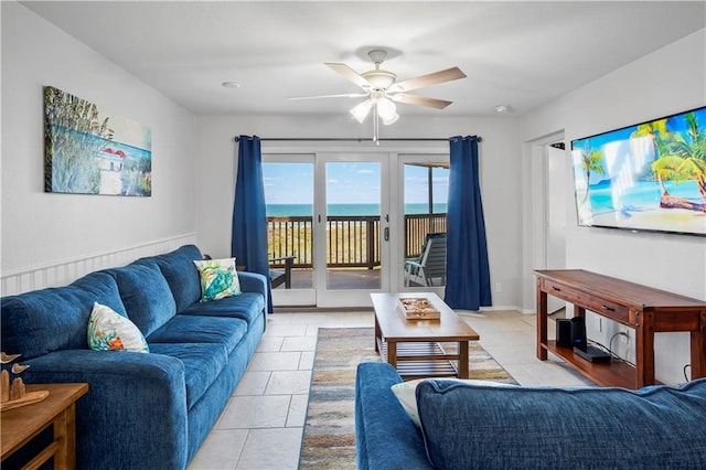 living room featuring light tile patterned floors and ceiling fan