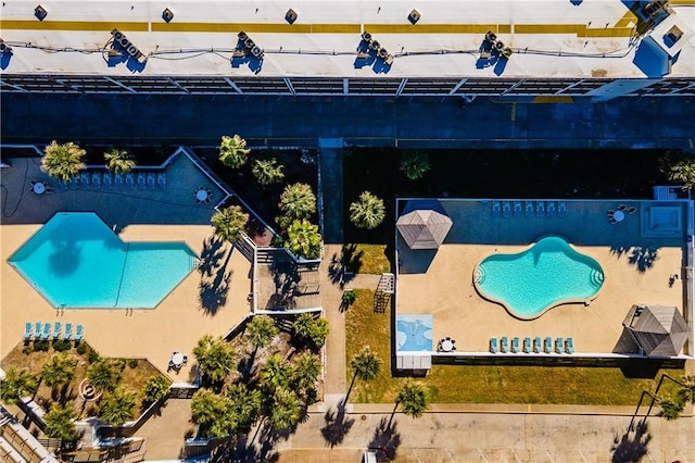 view of swimming pool featuring a patio area