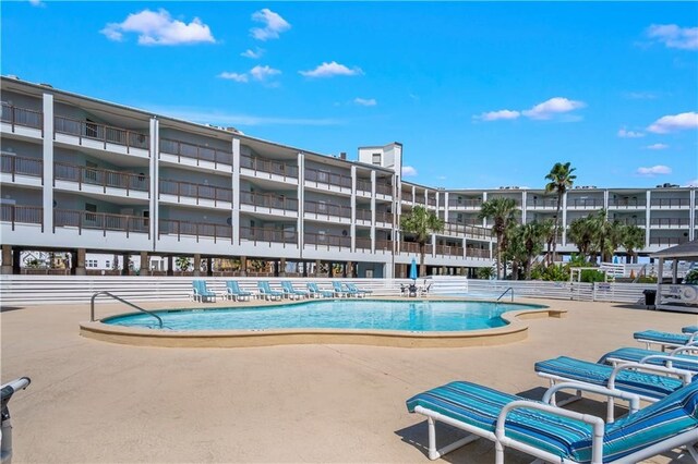 view of pool featuring a patio