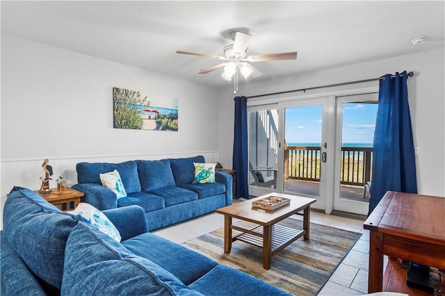 tiled living room with ceiling fan