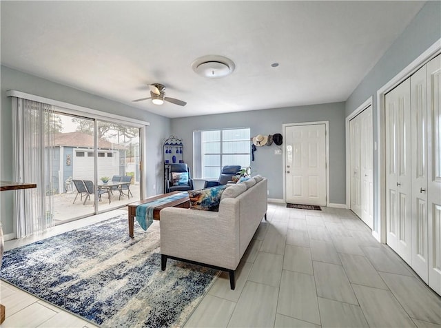 341 W Greenwood Ave, Aransas Pass, TX 78336 - living room with ceiling fan and baseboards