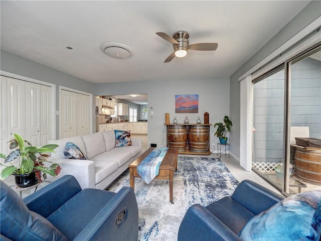 341 W Greenwood Ave, Aransas Pass, TX 78336 - living room featuring ceiling fan, light wood-style floors, and baseboards