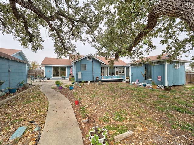 341 W Greenwood Ave, Aransas Pass, TX 78336 - rear view of house with a patio and an outdoor structure
