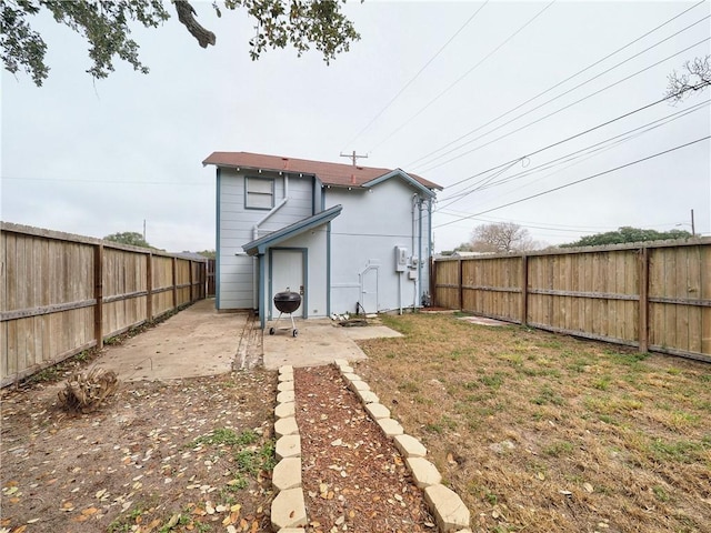 341 W Greenwood Ave, Aransas Pass, TX 78336 - rear view of property with a fenced backyard and a patio area
