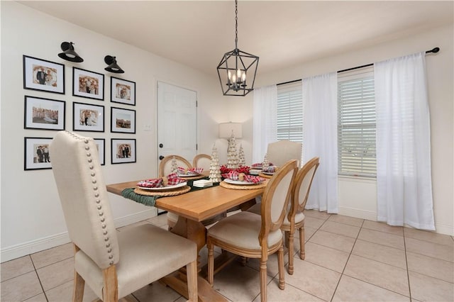 tiled dining area with a notable chandelier