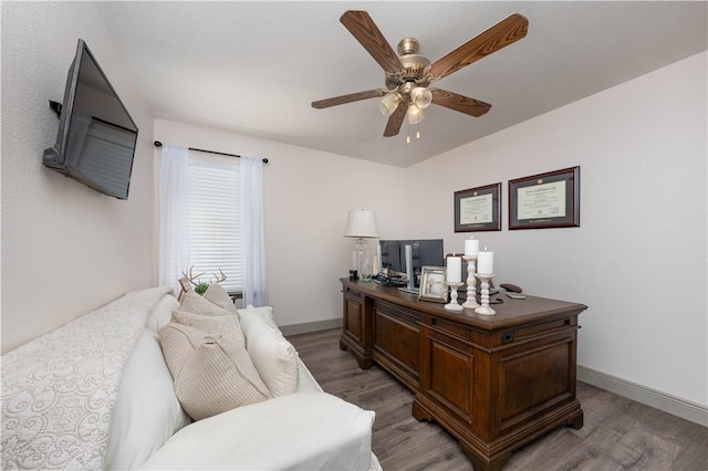 home office with ceiling fan and hardwood / wood-style flooring