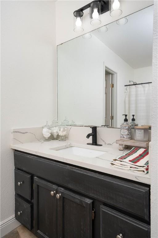 bathroom with a shower with curtain and vanity