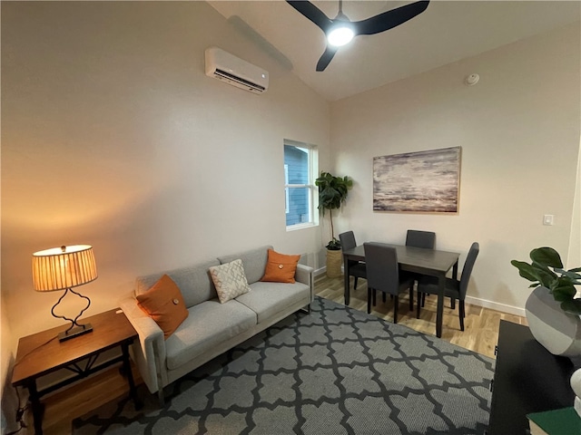 living room with ceiling fan, wood-type flooring, an AC wall unit, and lofted ceiling