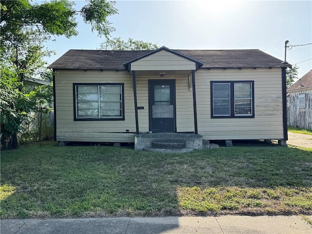 4721 Molina Dr, Corpus Christi, TX 78416 - bungalow-style house featuring a front yard and roof with shingles
