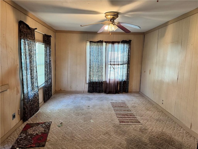 4721 Molina Dr, Corpus Christi, TX 78416 - carpeted empty room with a ceiling fan and wood walls