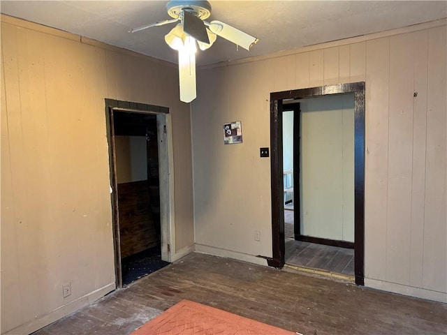 4721 Molina Dr, Corpus Christi, TX 78416 - spare room with a ceiling fan, hardwood / wood-style flooring, wooden walls, and baseboards