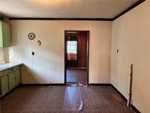 4721 Molina Dr, Corpus Christi, TX 78416 - kitchen featuring green cabinets, baseboards, light countertops, and dark floors